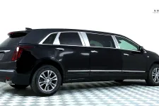 Thumbnail for Black luxury limousine with sleek lines, parked on a patterned floor against a white background.