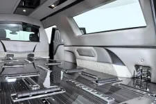 Thumbnail for Luxurious interior of a limousine featuring polished surfaces and spacious seating arrangements.