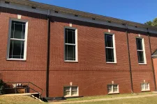 Thumbnail for a brick building with windows