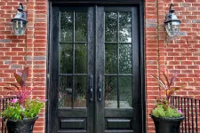 Thumbnail for brick house with black French style entry doors