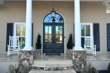 Thumbnail for Black double front doors with transom elevates the exterior of the house