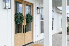 Thumbnail for Double wood and glass front door on a white house