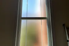 Thumbnail for a window with a light shining through