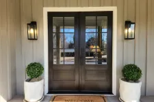 Thumbnail for Stained double front doors installed on board and batten house