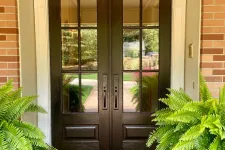 Thumbnail for Arched double entry door on brick house installed by North Georgia Replacement Windows