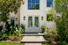 Thumbnail for White home with white double front doors