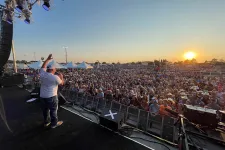 Thumbnail for a person on a stage with a crowd watching
