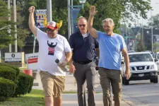 Thumbnail for a group of men walking on the sidewalk