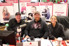 Thumbnail for Pat Phelan et al. sitting at a table with microphones