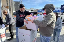 Thumbnail for a person handing a box to another man
