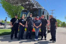 Thumbnail for a group of police officers standing in front of a helicopter