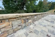 Thumbnail for a stone wall with a stone walkway