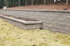 Thumbnail for a stone wall with a bench and a stone wall