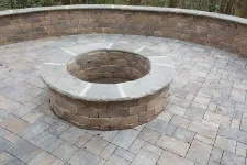 Thumbnail for a circular object on a brick surface