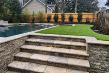 Thumbnail for a stone staircase leading up to a swimming pool