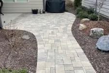 Thumbnail for a brick walkway between houses