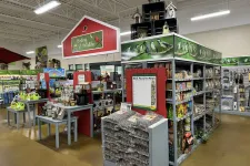 Thumbnail for Store section for birding and wildlife supplies with birdseed, feeders, and birdhouses on display.