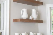 Thumbnail for a shelf with white vases and cups on it