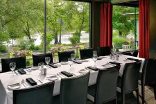 Thumbnail for a dining room table in front of a window