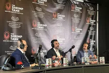 Thumbnail for Three men wearing headsets talk into microphones during a Shrimp Tank podcast recording with branded backdrop.