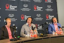 Thumbnail for Three men in headphones recording a podcast at a table with The Shrimp Tank and Florida Atlantic backdrop