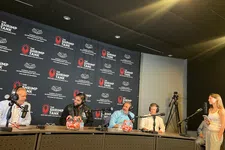 Thumbnail for Panel of five people in a studio podcast setup with microphones, headphones, and branding backdrop for The Shrimp Tank.