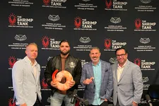 Thumbnail for Four men standing in front of The Shrimp Tank and Florida Atlantic Entrepreneurship Institute backdrop, holding shrimp prop, podcast setup