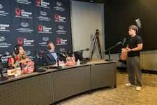 Thumbnail for A man pitches to two judges seated at a table with microphones and branded backdrop for The Shrimp Tank podcast.