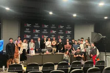 Thumbnail for Group of people posing in front of a backdrop with The Shrimp Tank logos, studio lighting visible, no overlaid text.
