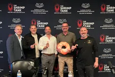 Thumbnail for Five men smiling in front of a backdrop branded with The Shrimp Tank and Florida Atlantic Entrepreneurship Institute logos with overlaid text.