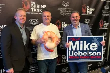 Thumbnail for Three men at The Shrimp Tank event with campaign sign and shrimp prop, promoting Mike Liebenson for Boca Raton mayor.