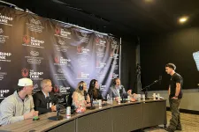 Thumbnail for Panel of five judges at The Shrimp Tank event evaluating a young presenter in a studio setting.