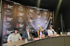 Thumbnail for Four podcast hosts with microphones seated at a table during The Shrimp Tank by Florida Atlantic University event.