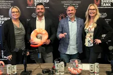 Thumbnail for Four people smiling at a podcast table with shrimp-themed decorations and The Shrimp Tank backdrop