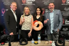 Thumbnail for Four people posing with shrimp-themed items at a podcast studio with The Shrimp Tank backdrop.