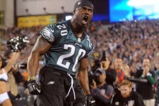Thumbnail for Brian Dawkins wearing a jersey and running