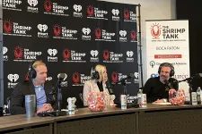 Thumbnail for a group of people sitting at a table with microphones