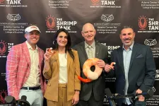 Thumbnail for Four people smiling at a shrimp-themed podcast with microphones and branded backdrop for The Shrimp Tank podcast.