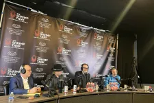 Thumbnail for Four men with headsets sitting at a podcast table with microphones and The Shrimp Tank backdrop