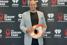 Thumbnail for Corey Saban holding a large snake