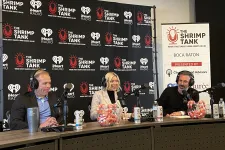 Thumbnail for a group of people sitting at a table with microphones