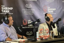 Thumbnail for Two men wearing headphones speaking into microphones during The Shrimp Tank podcast at Florida Atlantic University.