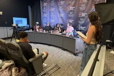 Thumbnail for Panelists and host engaged in discussion at The Shrimp Tank event with audience and recording setup in studio