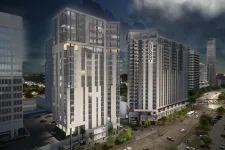 Thumbnail for Night view of modern high-rise residential buildings in an urban setting with lit windows and cityscape background