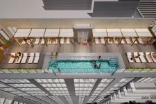 Thumbnail for Rooftop pool with lounge chairs and people relaxing under shaded pergolas on a modern high-rise building.