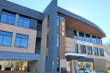 Thumbnail for Modern three-story office building with brick and dark panel exterior and large reflective windows at 620 address.
