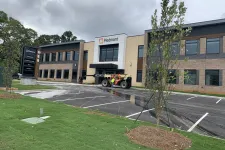 Thumbnail for Piedmont medical office building with parking lot, new landscaping, and cloudy sky.