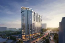 Thumbnail for Modern high-rise residential building at sunset with street view and greenery in an urban area