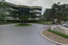 Thumbnail for West Boca Medical Arts Pavilion II outpatient surgery center building with signage and surrounding trees.