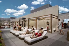 Thumbnail for People relaxing by a modern rooftop pool with lounge chairs, cabanas, and sunny sky with clouds.